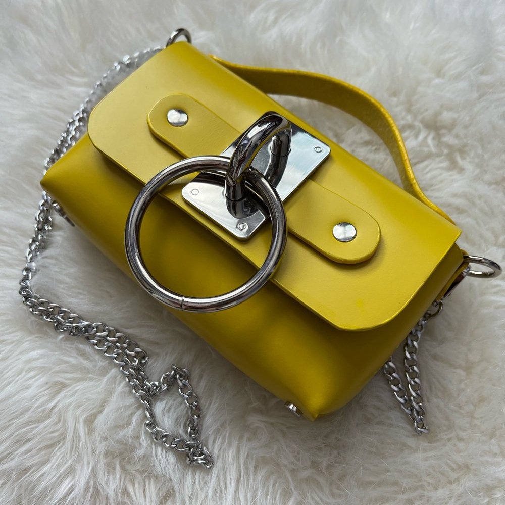 Zana Bayne Mini Choker Bag in yellow leather with silver hardware detail.